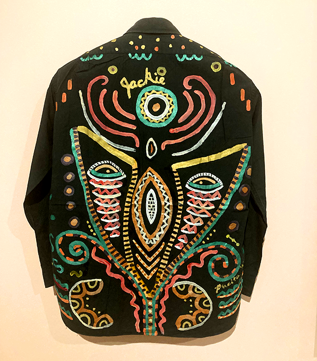 There are paintings made on clothing Pacita Abad “borrowed” from her husband, Jack.